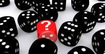 A red dice with a  question mark on it surrounded by numerous black dice